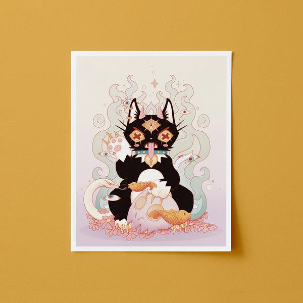 A vertical art print featuring a stylized black cat with decorative geometric and floral details, holding a white egg with two small gold fish inside, shown against a warm mustard-yellow background.
