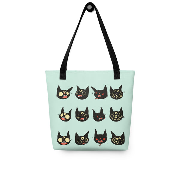 Hand-drawn artwork of black cat faces on a spacious tote bag with dual handles.