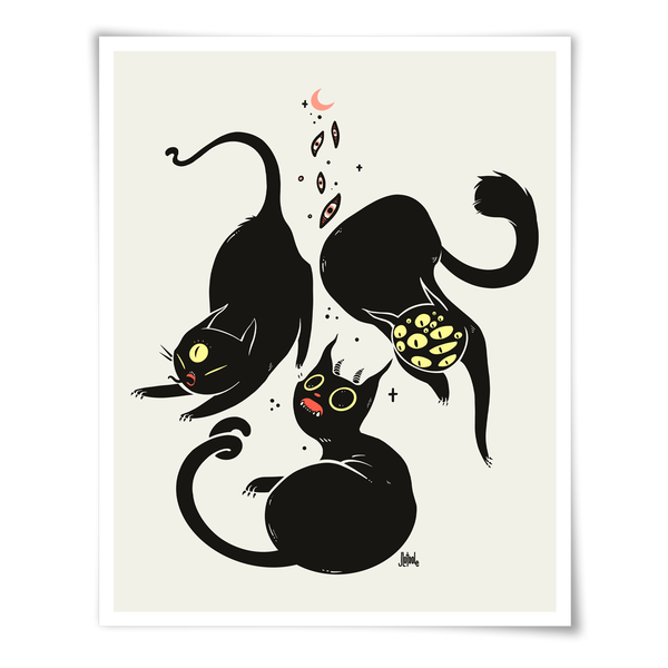 A minimalist art print featuring three black cats in playful, whimsical poses on a warm cream background, with small yellow and pink accents. The print is presented with a clean white border and drop shadow against a white background.