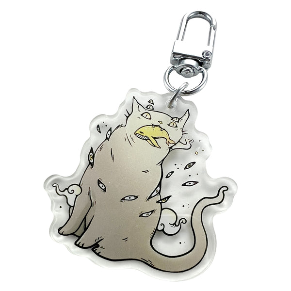 Cat & Whale, Keychain featuring a unique illustration of a whimsical cat with multiple eyes.