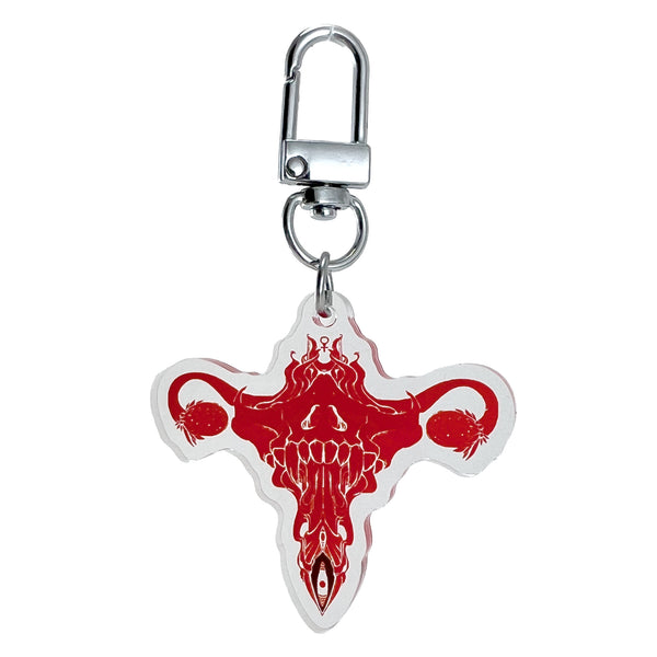 Death Metal Uterus, Keychain featuring original illustration in red on clear acrylic with U-shaped hook clasp.