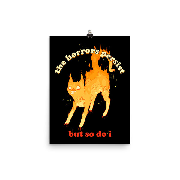 Matte art print of a fiery cat with the quote 'The Horrors Persist But So Do I' for decorative wall art.