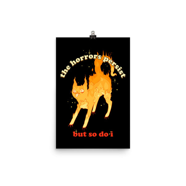 Matte art print featuring a flaming cat illustration with quote: 'The Horrors Persist But So Do I.'
