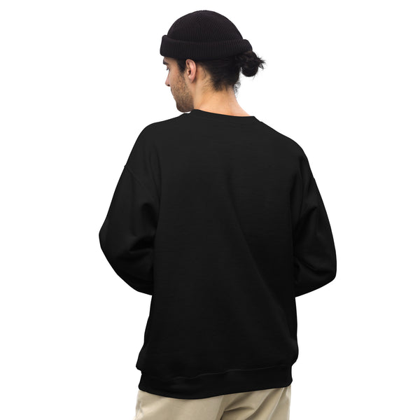 Person wearing a black sweatshirt with a small flag patch on the back, standing against a white background
