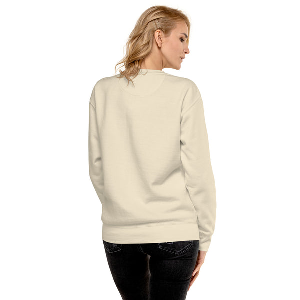 Back view of a woman wearing a soft Wolves & Eyes unisex sweatshirt, showcasing its cozy fit and stylish design.