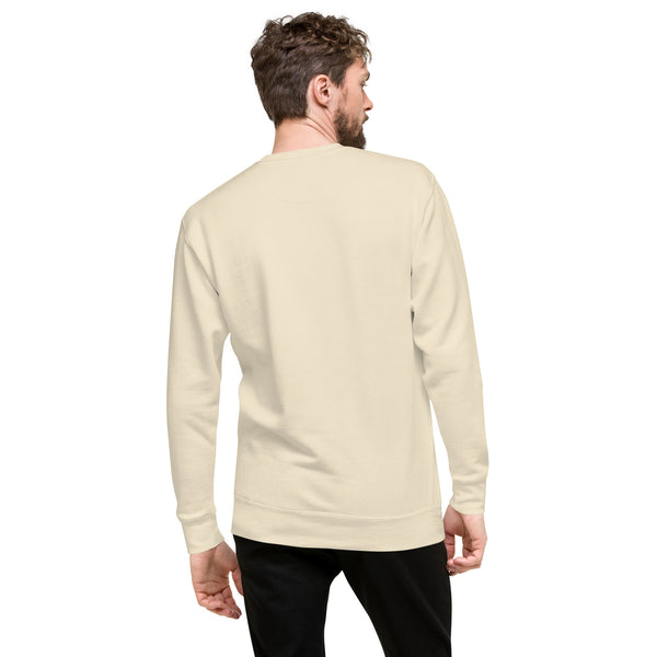 Back view of a man wearing a premium unisex sweatshirt in cream color, showcasing a cozy and stylish design.