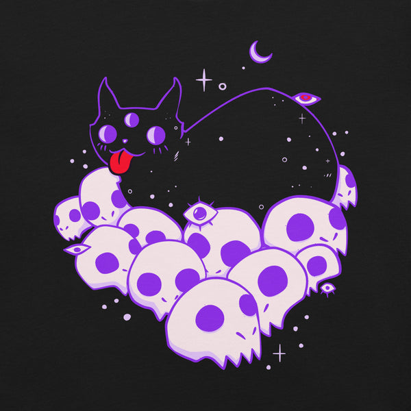 Cute black cat with three eyes lying on purple skulls, graphic design on a black unisex t-shirt.