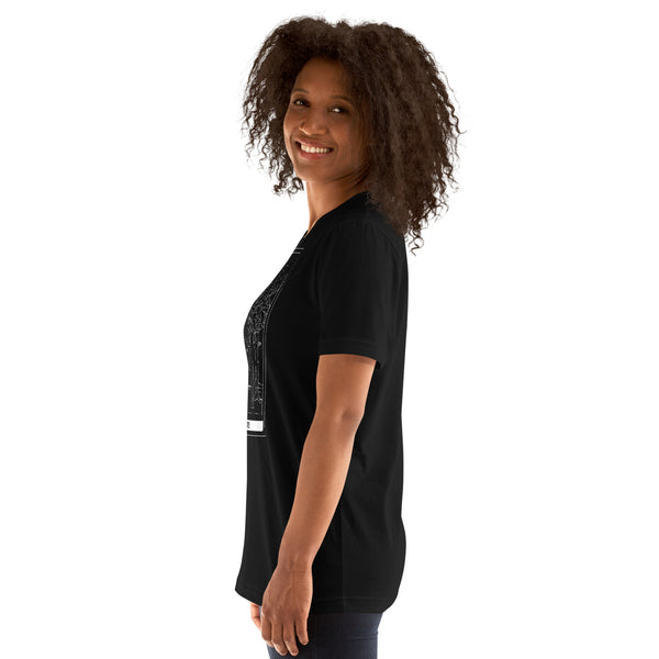Side view of a smiling woman wearing a black unisex t-shirt featuring The Lovers tarot card design.