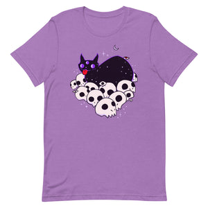 Cute black cat lying on skulls graphic tee, unisex soft and stretchy cotton t-shirt in lavender color.