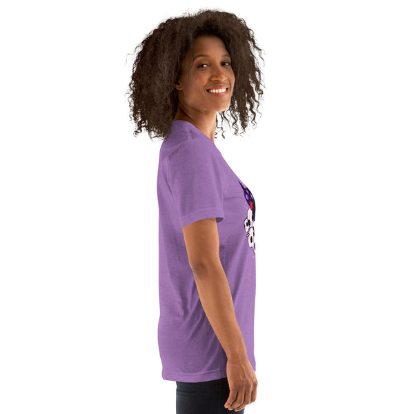 Unisex purple t-shirt featuring a cute black cat design lying on skulls, modeled by a smiling woman.