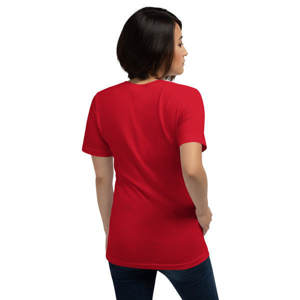 Woman wearing a red unisex T-shirt featuring a unique wolf and crown design, emphasizing comfort and style.