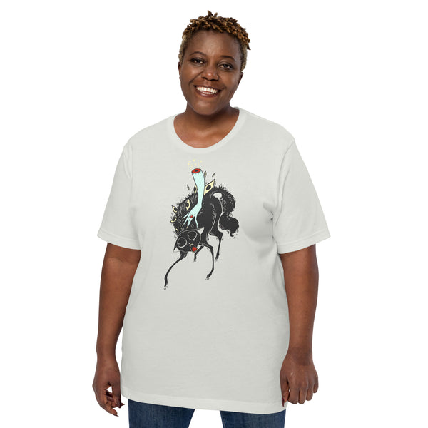Unisex gray t-shirt featuring a black cat illustration being petted by a witch's hand, modeled by a smiling woman.