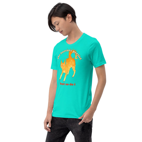 Unisex teal t-shirt with an illustration of a fire cat and the quote 'The horrors persist but so do I'