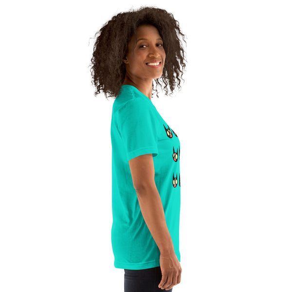 Model wearing a unisex t-shirt featuring cute black cat faces in a bright teal color.