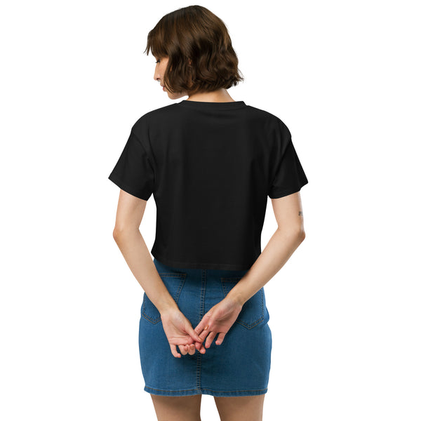 Back view of a relaxed black crop top, highlighting its casual fit and style. Perfect for trendy outfits.