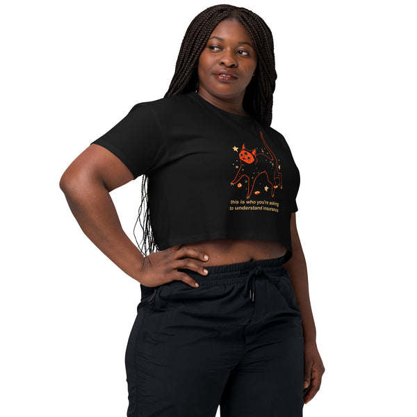 Model wearing Orion Insurance, Relaxed Crop Top featuring a black cat illustration and a meme quote about insurance.