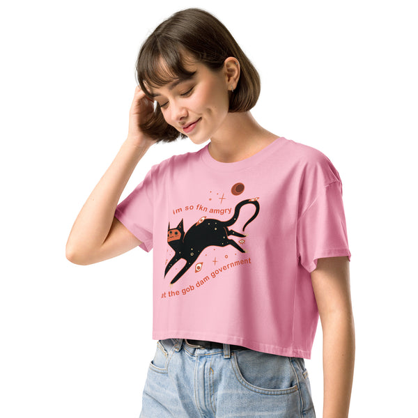 Amgry Orion, Relaxed Crop Top featuring a black cat illustration and meme text design on a pink background.