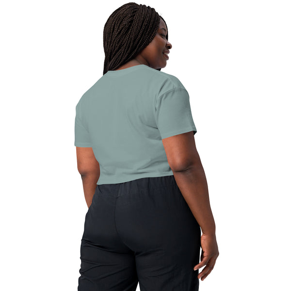 Model wearing a relaxed fit cropped top in mint green, showcasing a comfortable back design.