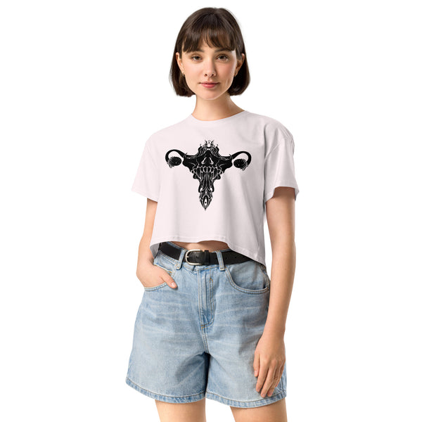 Woman wearing Death Metal Uterus crop top with original hand-drawn artwork, relaxed fit, perfect for alt or witchy aesthetic.