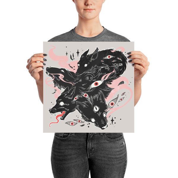 Person holding a matte art print of a wolf illustration featuring many black wolves and eyes, designed for wall decor.